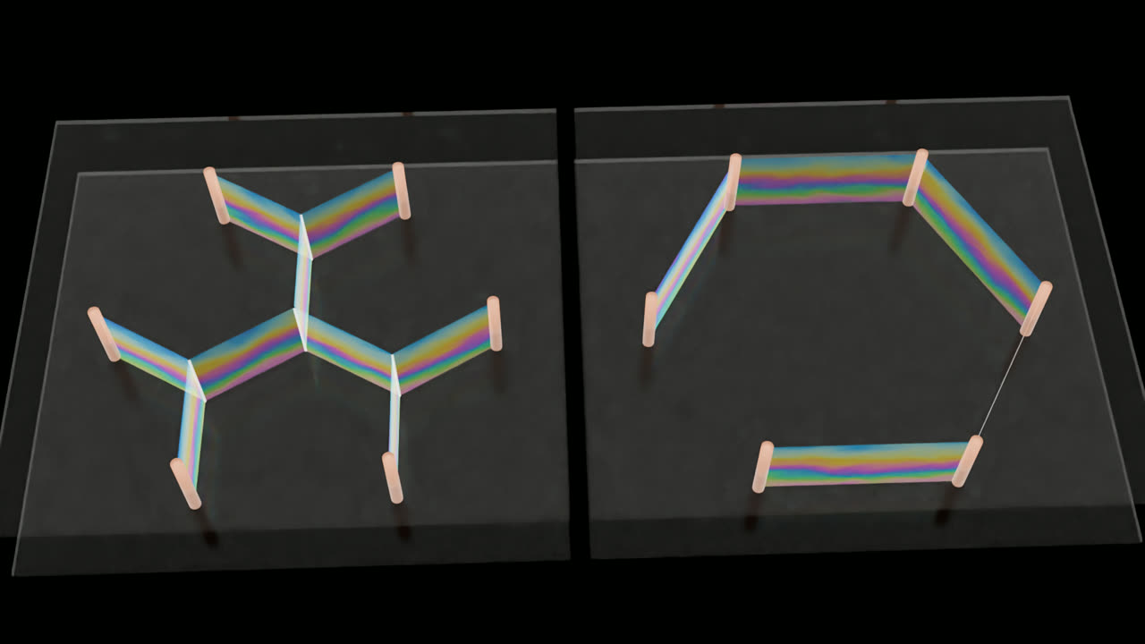 Two six-pin soap-film rigs in an archived Blender look test